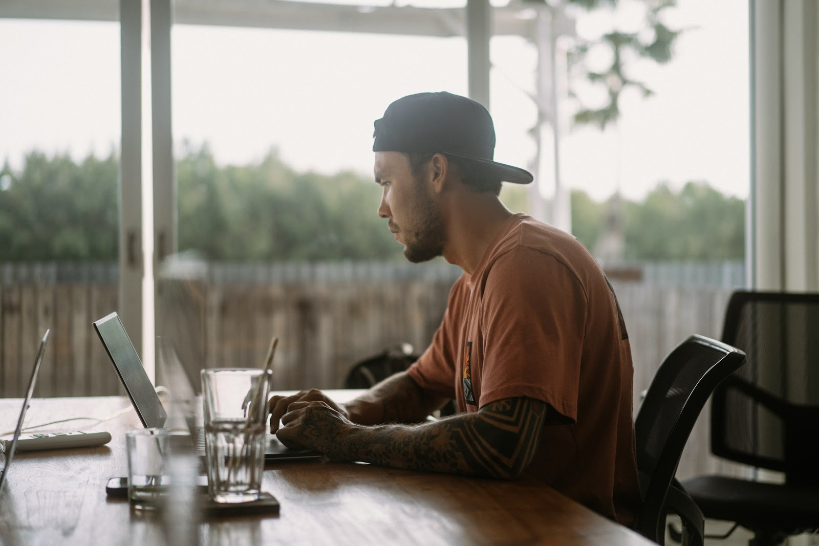 man working from a cafe