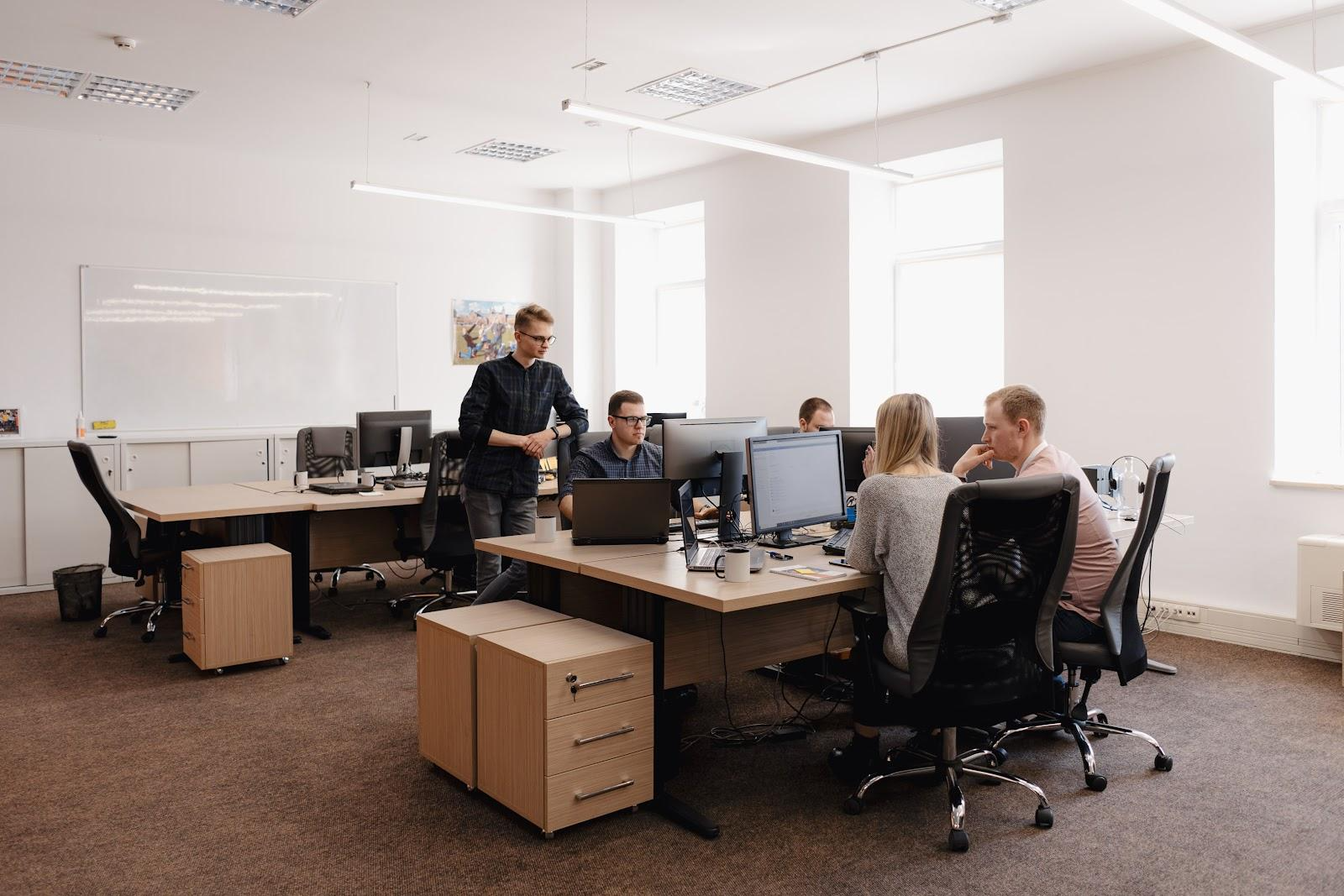 coworkers at an office desk